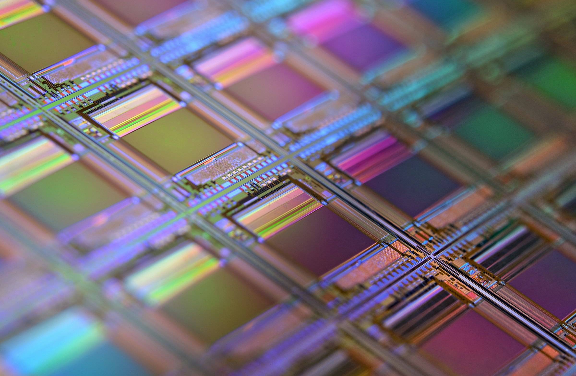 A silicon wafer of microchips catching the light